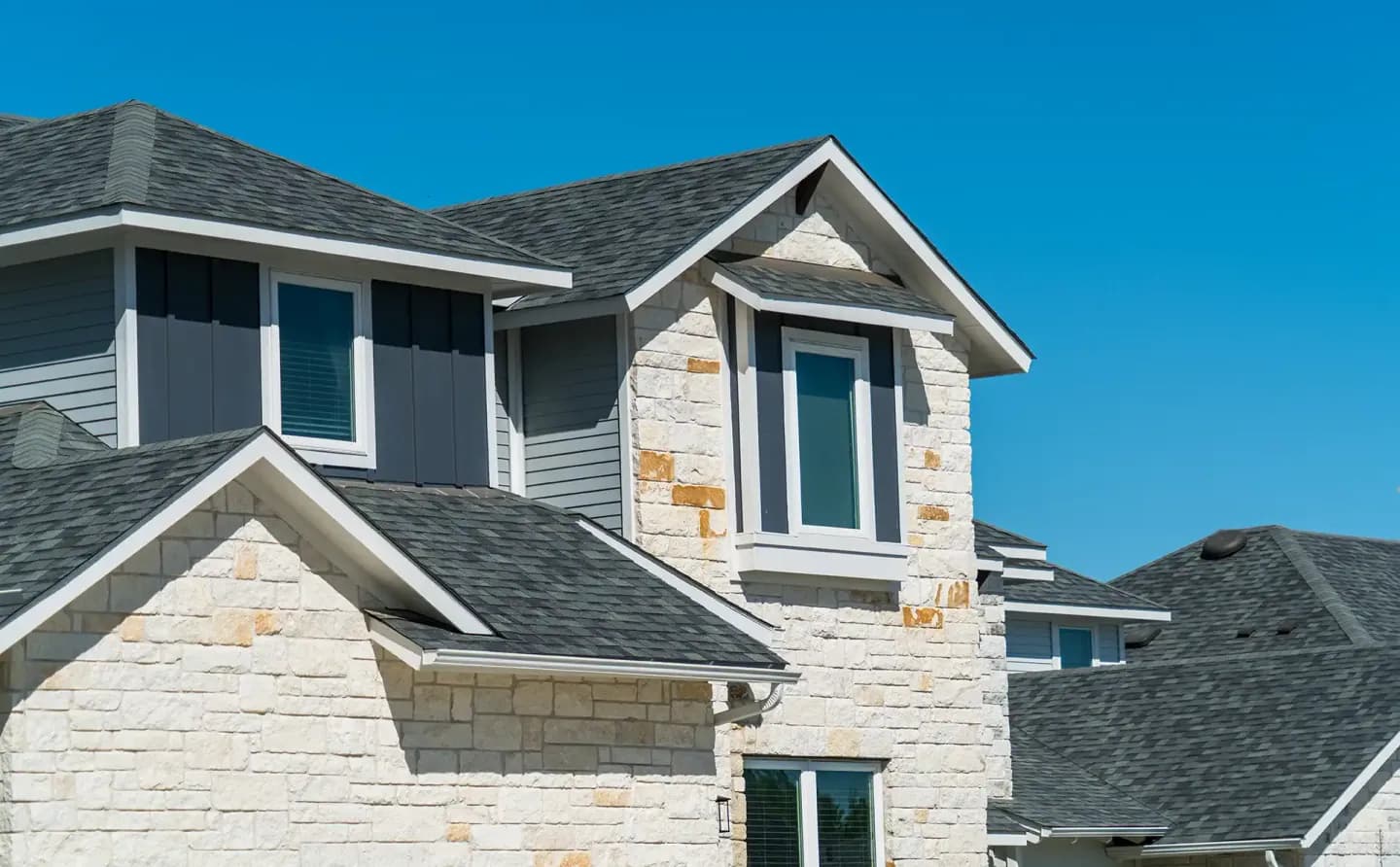 Two-story Texas home with a new shingle roof