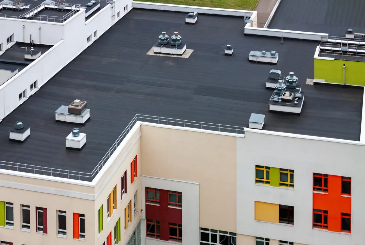 Commercial building with a flat low-slope roof and rooftop units