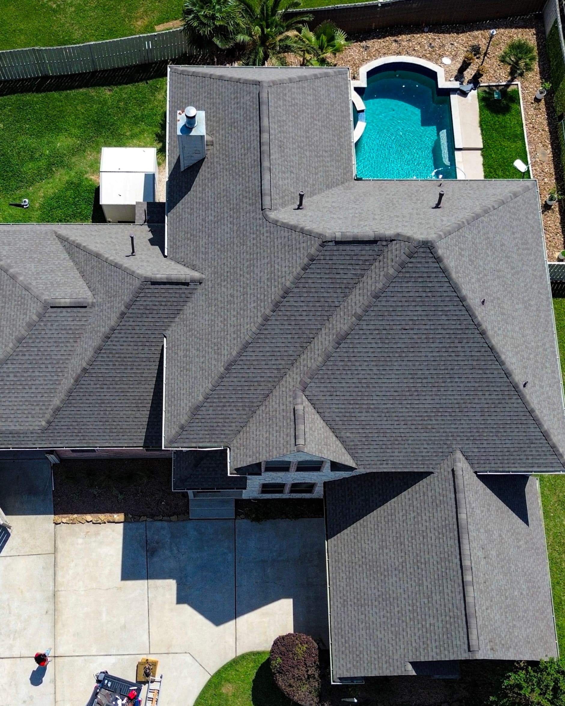 Completed gray shingle roof photographed from above