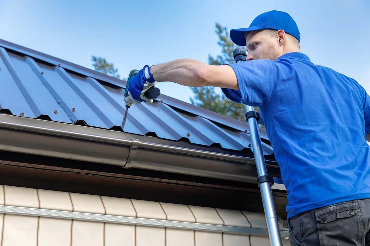Roofer repairing a roof edge